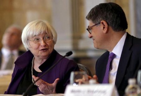 Federal Reserve Chair Janet Yellen chats with Treasury Secretary Jack Lew as they attend a meeting of the Financial Stability Oversight Council at the Treasury Department in Washingt