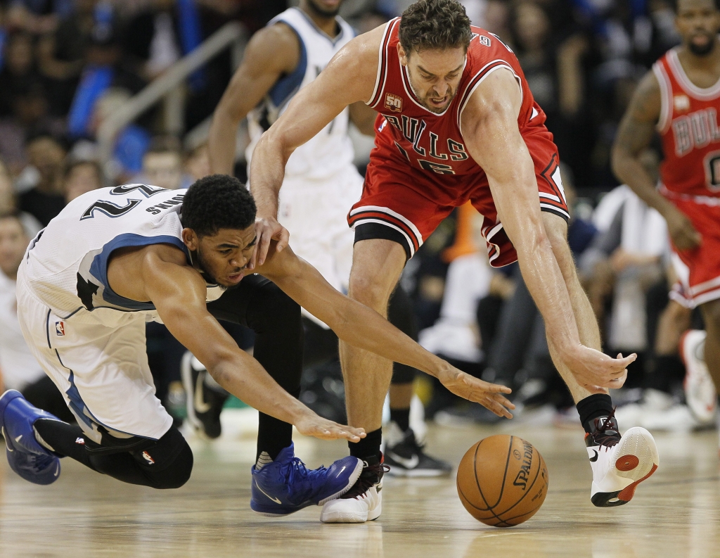 Chicago Bulls&#039 Pau Gasol right and Minnesota Timberwolves&#039 Karl Anthony Towns drive for the ball during the second half of an NBA preseason basketball game Saturday Oct. 10 2015 in Winnipeg Manitoba. (John Woods  The Canadian Press via