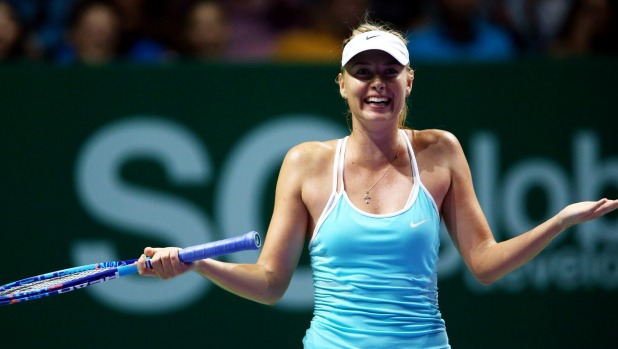 Maria Sharapova of Russia reacts after a three set victory againt Agnieszka Radwanska of Poland