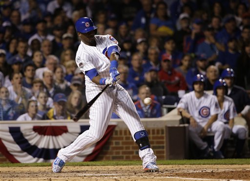 Chicago Cubs Austin Jackson scores in front of St. Louis Cardinals catcher Yadier Molina during the second inning of Game 2 in baseball's National League Division Series Saturday Oct. 10 2015 in St. Louis