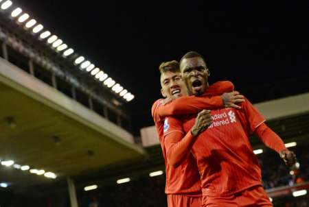 Liverpool's Christian Benteke celebrates with Roberto Firmino after scoring the opening goal of the Premier League match against Southampton at Anfield stadium