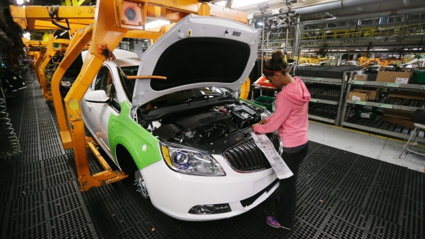 Final trim is installed on a Buick Verano at the Orion Assembly in Orion Township Mich. General Motors third-quarter profit fell slightly but strong North American sales helped it overcome ignition switch costs