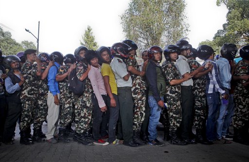 Nepalese motorists line up to buy fuel on their motorbikes at a fuel pump run by the Nepalese army in Kathmandu Nepal. Fuel-starved Nepal has signed an agreement with China to provide gasoline diesel and cooking