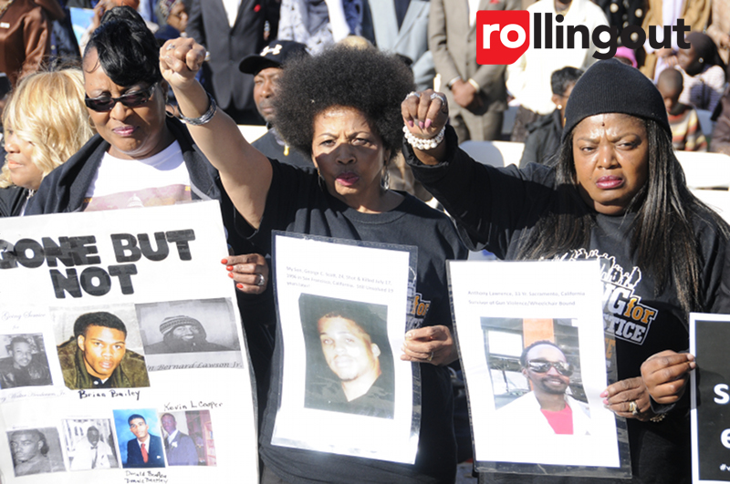 Black women peacefully protest the deaths of loved ones the lawn outside of the Capitol