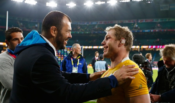 Michael Cheika and David Pocock embrace after the Wallabies beat Argentina for a place in the Rugby World Cup final against the All Blacks