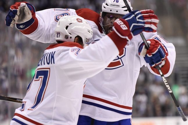 Montreal Canadiens Alex Galchenyuk celebrates his goal against the Toronto Maple Leafs with teammate P.K. Subban during third period NHL action in Toronto on Wednesday Oct. 7 2015. THE CANADIAN PRESS  Frank Gunn