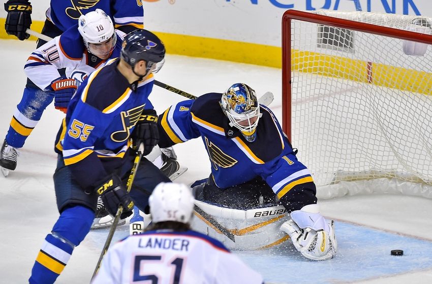 St. Louis Blues Robby Fabbri right scores past Edmonton Oilers goalie Cam Talbot and Ryan Nugent-Hopkins bottom left during the third period of an NHL hockey game Thursday Oct. 8 2015 in St. Louis. The Blues won 3-1