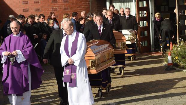 The coffins of the Connors family Thomas 27 his wife Sylvia 25 and three of their children leave the Church of the Ascension of the Lord in Balally Co Dublin following their funeral