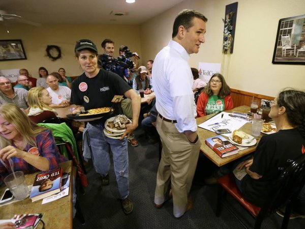 Republican presidential candidate Sen. Ted Cruz R-Texas talks with local residents during a campaign stop at the Pizza Ranch Monday Oct. 12 2015 in Rockwell City Iowa