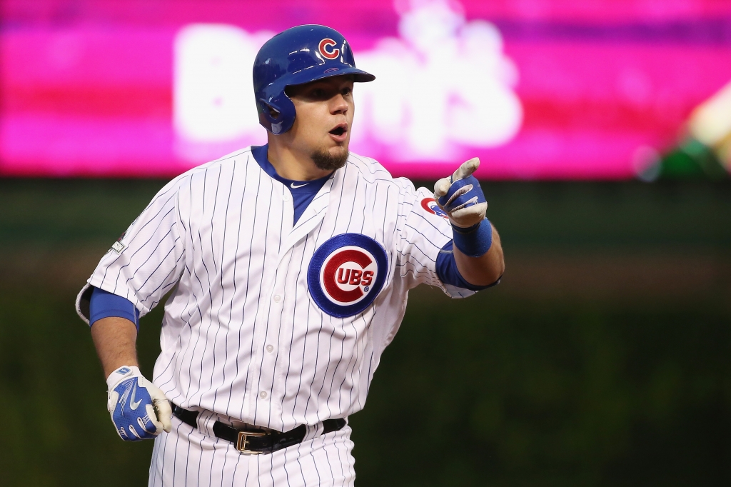 CHICAGO IL- OCTOBER 13 Kyle Schwarber #12 of the Chicago Cubs points to the dugout after hitting a solo home run in the seventh inning against the St. Louis Cardinals during game four of the National League Division Series at Wrigley Field on October