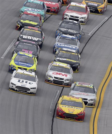 Sprint Cup Series driver Joey Logano leads Dale Earnhardt Jr., and rest of the field during the NASCAR Sprint Cup Series auto race at Talladega Superspeedway Sunday Oct. 25 2015 in Talladega Ala. Lagano won the race and Earnhardt finished