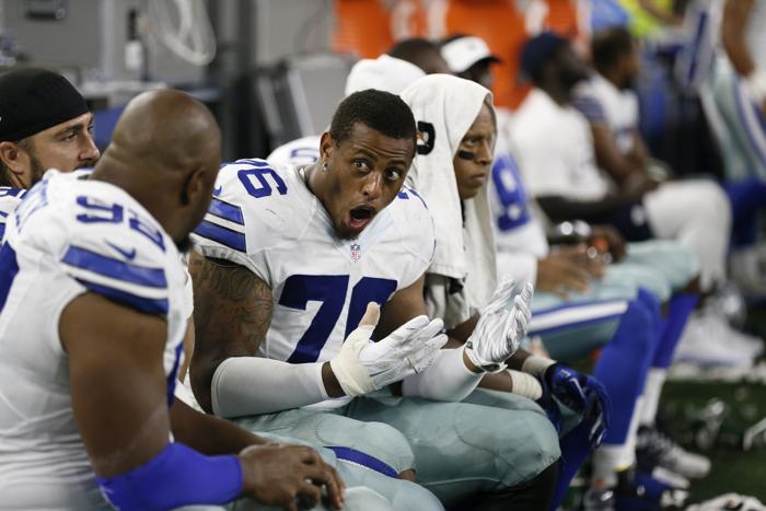 Dallas Cowboys Greg Hardy talks with teammates during the second half of a preseason NFL football game against the Minnesota Vikings Saturday Aug. 29 2015 in Arlington Texas