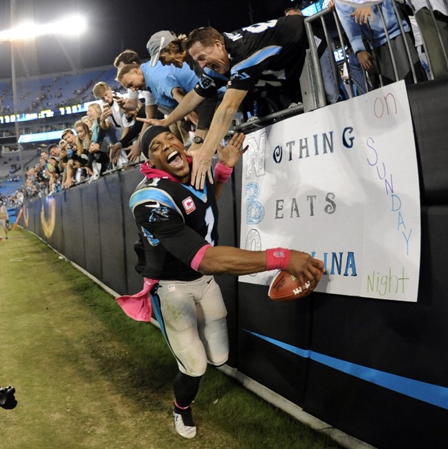 Carolina Panthers Cam Newton celebrates with fans after an NFL football game against the Philadelphia Eagles in Charlotte N.C. Sunday Oct. 25 2015. The Panthers won 27-16