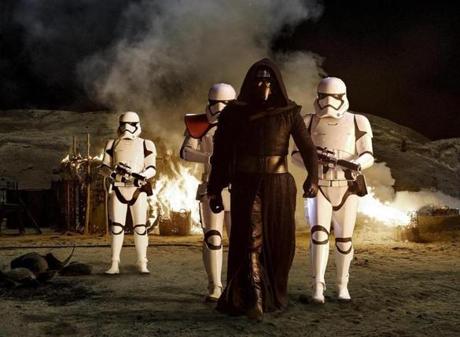 Kylo Ren with Stormtroopers in “Star Wars The Force Awakens.”