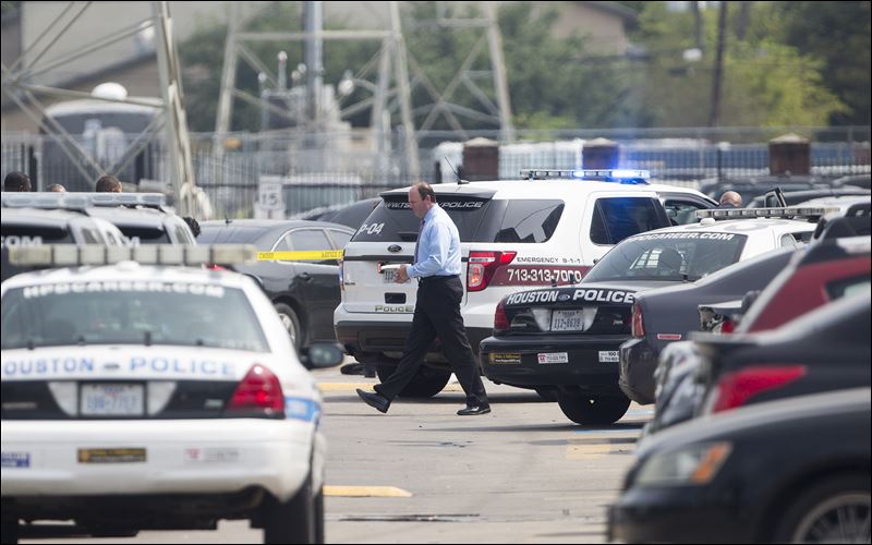 Houston Police vehicles respond after a shooting at Texas Southern University Friday in Houston. A student was killed and another person was wounded in a shooting outside a student-housing complex on Friday and police have detained at least two people