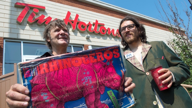 Rhinoceros Party Leader Sebastien Co Rhino Corriveau right and candidate Ben 97 Benoit stand in front of a Tim Hortons in Montreal in August