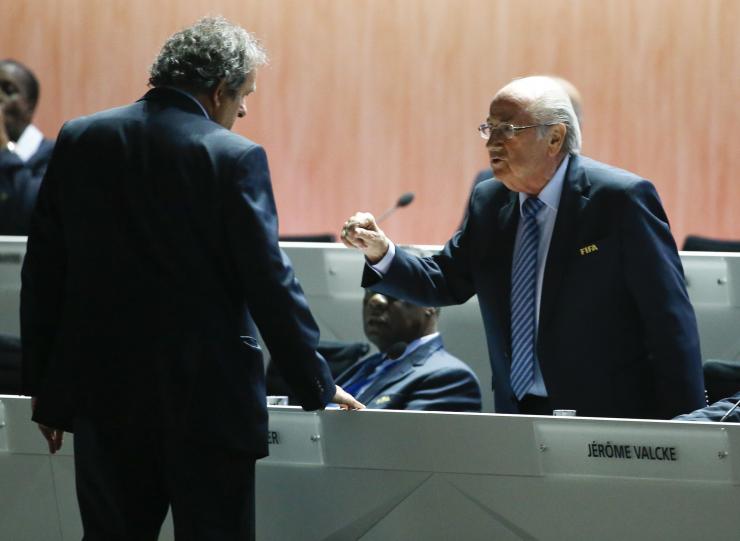 Sepp Blatter and Michel Platini talking at a FIFA congress