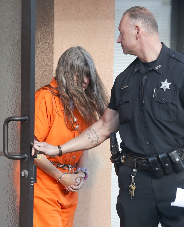 Deborah Leonard leaves New Hartford Town Court on Friday Oct. 16 2015 in New Hartford N.Y. Deborah Leonard is one of the parents charged with beating their teenage son to death inside a church. Both parents are giving diverging versions of what happen