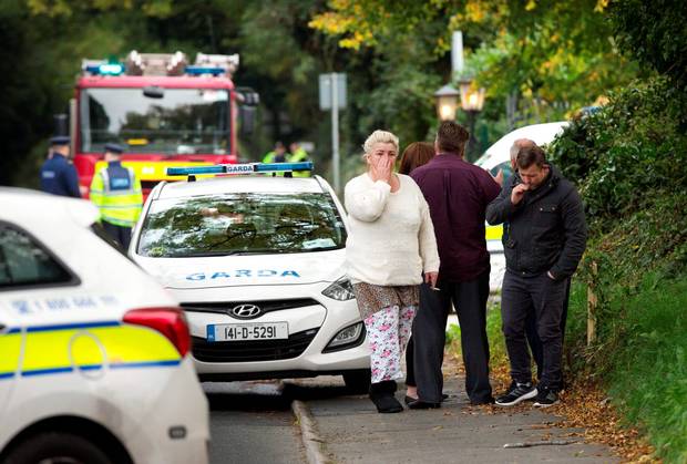 Gardai and fire services at the scene of the tragic fire at Glenamuck Road Carrickmines this morning