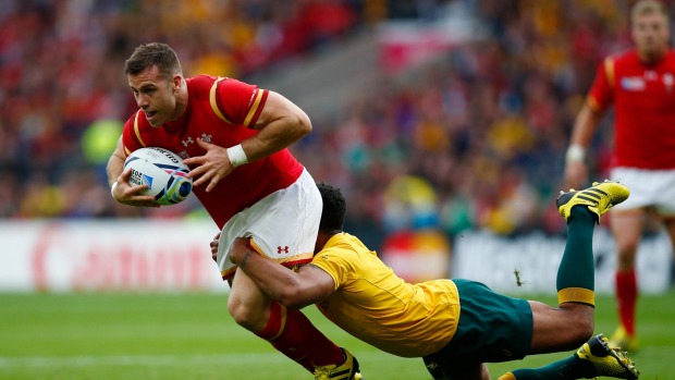 Gareth Davies is tackled by the Wallabies Will Genia