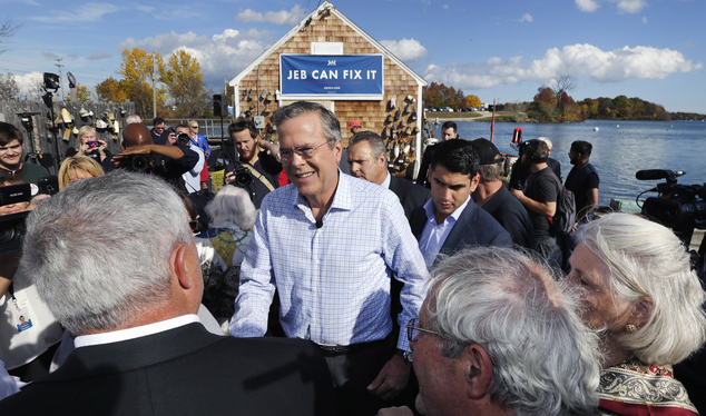 Republican presidential candidate former Florida Gov. Jeb Bush shakes hands with supporters during a campaign stop outside Geno's Chowder and Sandwich Shop