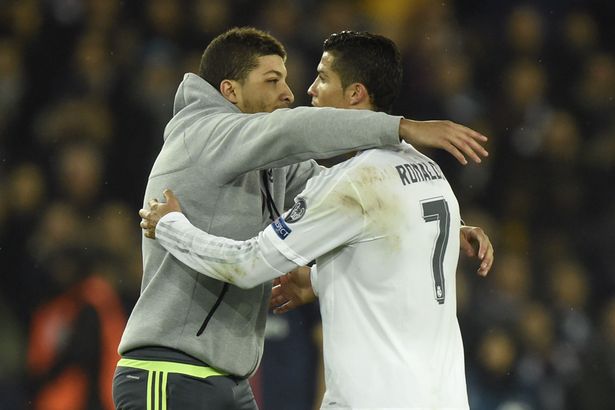 Cristiano Ronaldo with a pitch invader