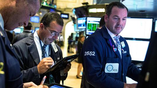 Traders work on the floor of the New York Stock Exchange