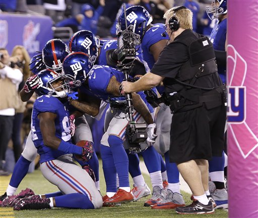 New York Giants tight end Larry Donnell is congratulated by teammates after scoring the game-winning touchdown against the San Francisco 49ers during the fourth quarter of an NFL football game Sunday Oct. 11 2015 in East Rutherford N.J. (AP Phot