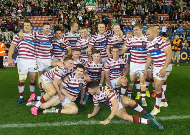 Wigan's player celebrate reaching the Grand Final after beating Huddersfield