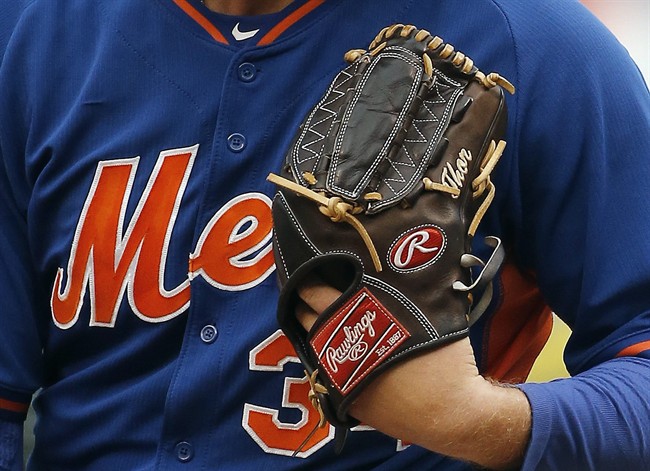 New York Mets pitcher Noah Syndergaard has the name Thor monogrammed on his glove as he throws at batting practice for the Major League Baseball World Series against the Kansas City Royals Monday Oct. 26 2015 in Kansas City Mo