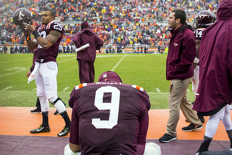 Virginia Tech's quarterback Brenden Motley sits on the bench after their NCAA college football game against Pittsburgh Saturday Oct. 3 2015 in Blacksburg Va