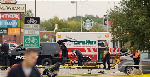 Emergency personnel respond after a vehicle crashed into a crowd of spectators during the Oklahoma State University homecoming parade causing multiple injuries on Saturday Oct. 24 2015 in Stillwater Oka