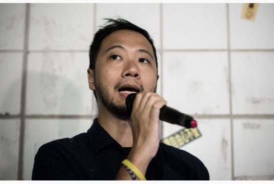 Political activist Ken Tsang talks to the media at the spot where he was allegedly beaten up by policemen in Hong Kong