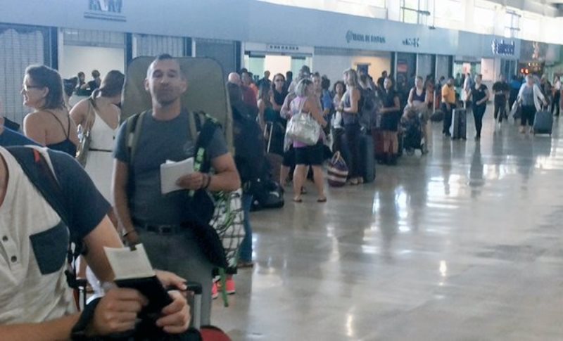 Canadians are lined up and ready to leave Puerto Vallarta on Sunday Oct. 25 2015 two days after Hurricane Patricia hit the Mexican coast