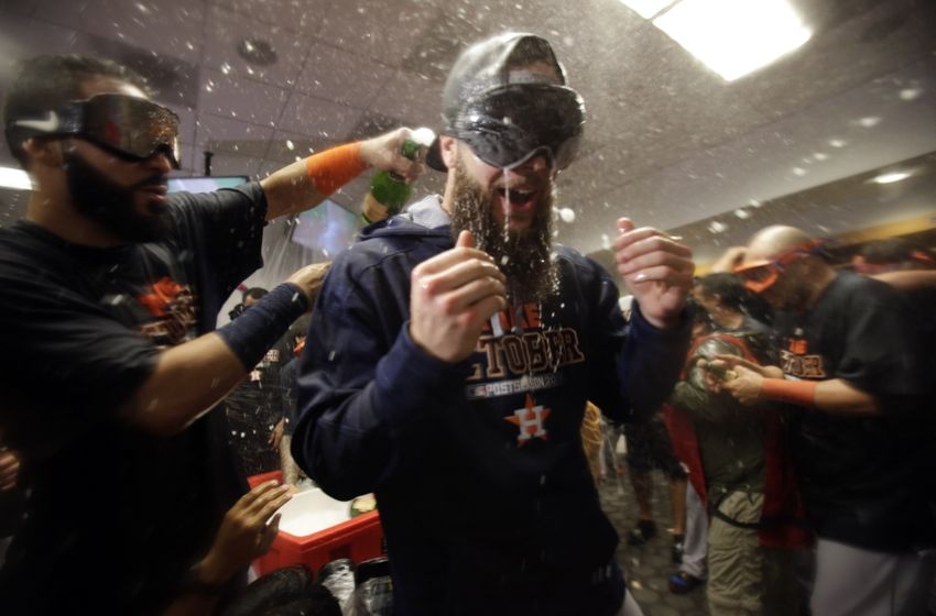 NEW YORK NY- OCTOBER 06 Dallas Keuchel #60 of the Houston Astros celebrate with his teammates in the locker room after defeating the New York Yankees in the American League Wild Card Game at Yankee Stadium