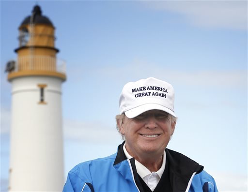 Republican presidential candidate Donald Trump poses for the media during the third day of the Women's British Open golf championship on Trump's Turnberry golf course in Turnberry Scotland. Republican