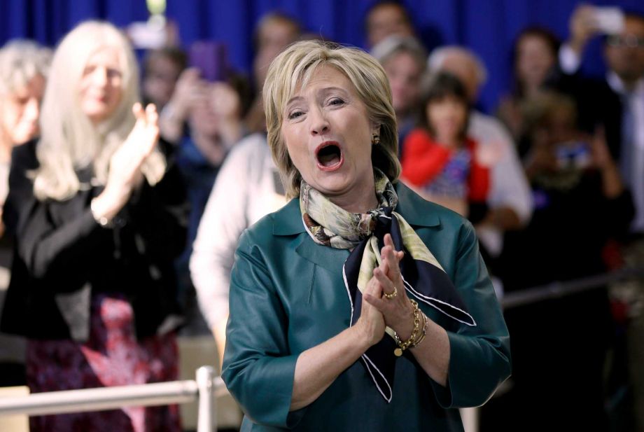 Democratic presidential candidate Hillary Rodham Clinton reacts to a supporter before speaking at a community forum Tuesday Oct. 6 2015 in Davenport Iowa