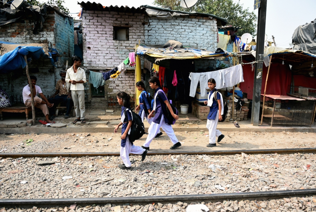 Indian girls walk on a railway track near a slum area of New Delhi. A toddler and a five-year-old girl were raped in separate attacks in New Delhi overnight with at least one gang-raped. – AFP pic