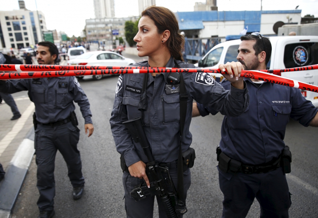 Israeli police officers cordon off at the scene of the