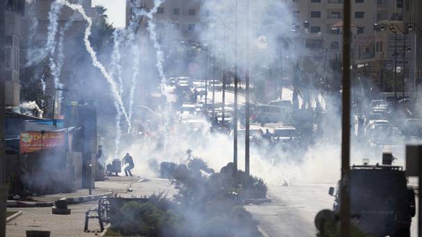 Israeli troops fire tear gas during clashes with Palestinian demonstrators near Ramallah