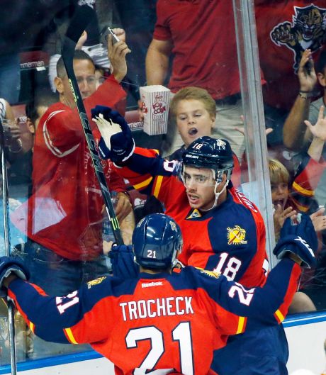 Florida Panthers right wing Reilly Smith and center Vincent Trocheck celebrate after Smith scored a goal during the first period of an NHL hockey game against the Philadelphia Flyers Saturday Oct. 10 2015 in Sunrise Fla