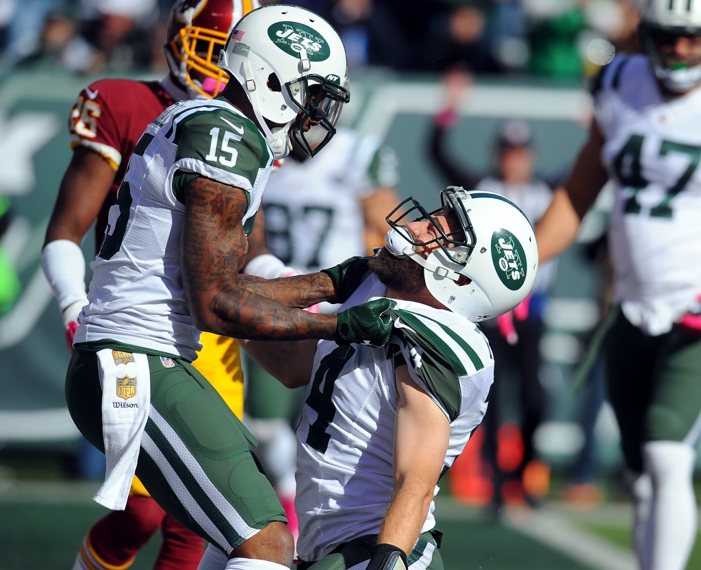 Met Life Stadium East Rutherford N.J. New York Jets lead 20-13 in the 3rd quarter New York Jets quarterback Ryan Fitzpatrick #14 runs for a td in the 3rd quarter celebrates with New