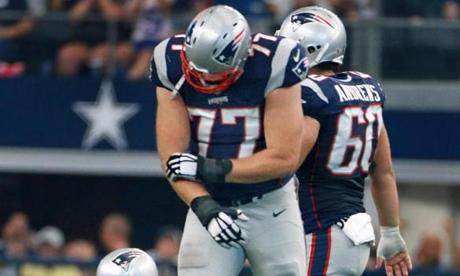 10/11/15 Arlington TX Patriots offensive lineman Nate Solder grabs his right forearm as he appeared to have been injured on a play in which quarterback Tom Brady hit the deck late in the second quarter. Center DAve A