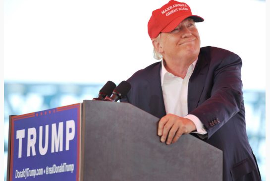 The front-runner for the Republican nomination for U.S. president dons a baseball cap for a speech Sunday in Jacksonville Fla