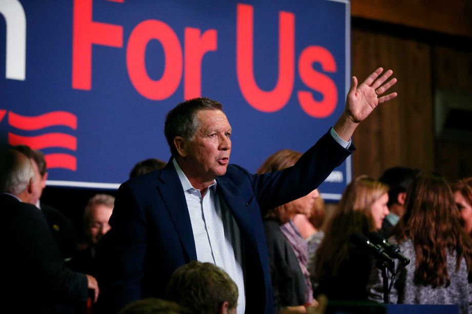 Republican presidential candidate Ohio Gov. John Kasich waves to supporters during a rally at Everal Barn & Homestead in Westerville Ohio Tuesday Oct. 27 2015. Kasich plans to attend the third Republican presidential debate that takes place Wednesday