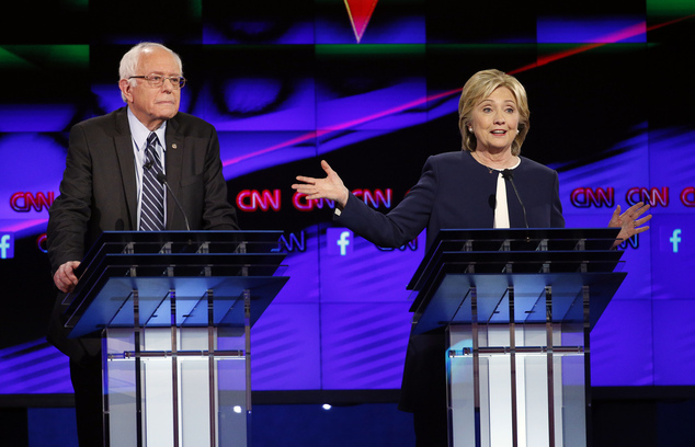 Hillary Rodham Clinton right speaks as Sen. Bernie Sanders of Vermont looks on during the CNN Democratic presidential debate Tuesday Oct. 13 2015 in L