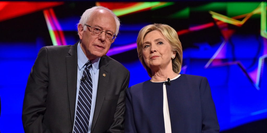 Democratic presidential candidates Sen. Bernie Sanders of Vermont left and Hillary Rodham Clinton talk before the CNN Democratic presidential debate Tuesday Oct. 13 2015 in Las Vegas