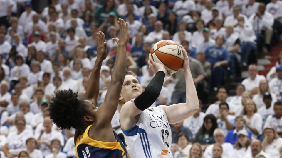 Minnesota Lynx guard Lindsay Whalen drives on Indiana Fever guard Shenise Johnson in the first half of Game 5 of the WNBA basketball finals Wednesday Oct. 14 2015 in Minneapolis