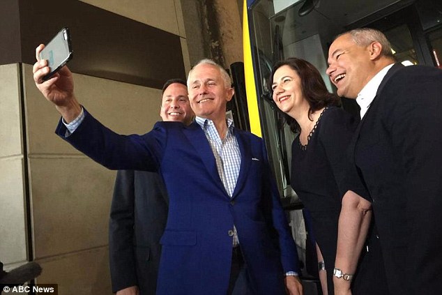 Malcolm Turnbull takes a selfie with Premier Annastacia Palaszczuk and Gold Coast Mayor Tom Tate