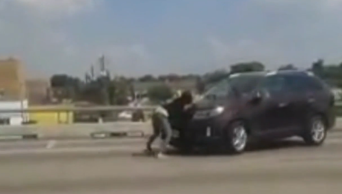 Pregnant woman rides on hood of SUV for a mile on Houston highway in fight